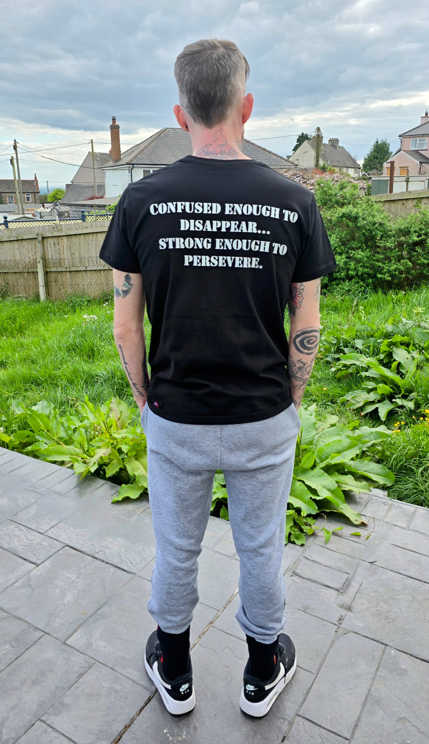 Confused enough to disappear... Strong enough to persevere Tee